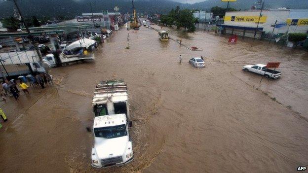 View of flooded streets in Acapulco, Guerrero state, on 15 September 2013