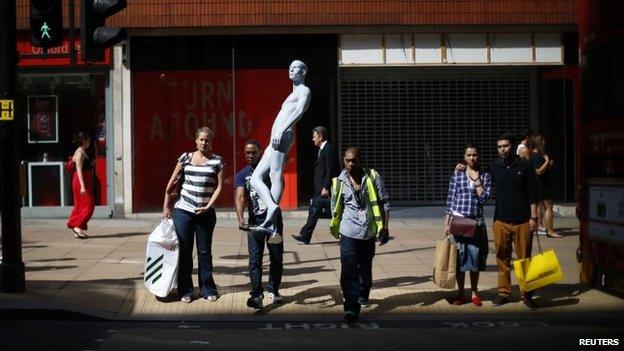 Shoppers and man with mannequin