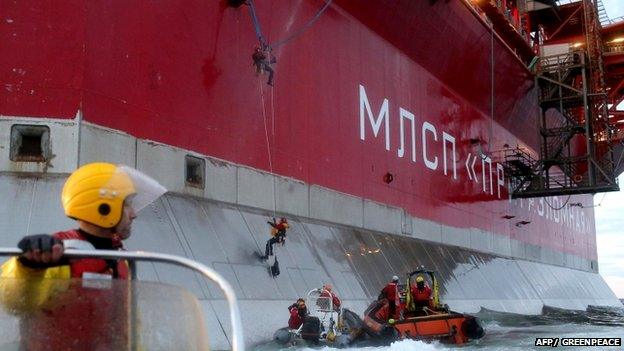 Greenpeace picture of two activists scaling side of Prirazlomnaya oil platform