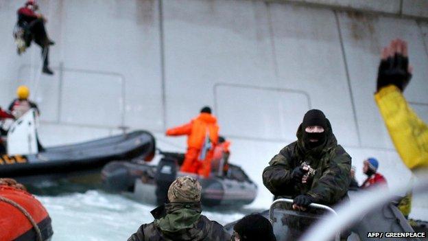 Coastguard points gun at activist on Greenpeace boat