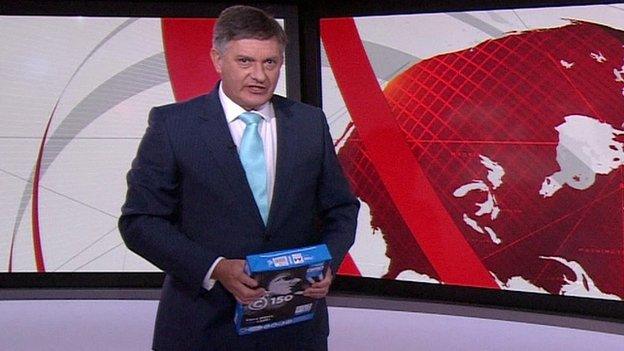 Simon McCoy holding a ream of A4 paper
