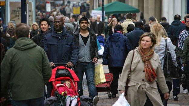 A busy street in London with people of several different ethnicities