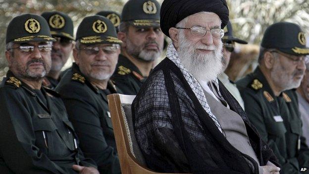 In this file photo released by the official website of the Iranian supreme leader's office on Monday, 27 May, 2013, supreme leader Ayatollah Ali Khamenei, foreground right, attends a graduation ceremony of a group of Revolutionary Guard members, in Tehran, Iran.