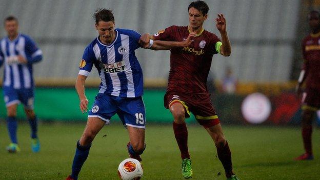 Nick Powell contests a challenge