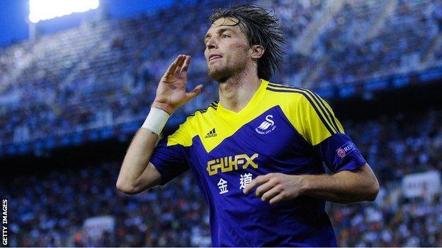 Michu celebrates his goal