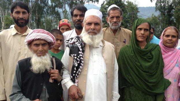 Mohammad Ayub (centre) with his family