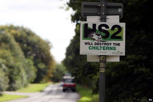 Sign on side of country road says "HS2 will destroy the Chilterns"