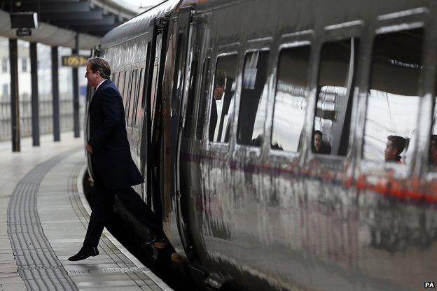 David Cameron alighting from a train