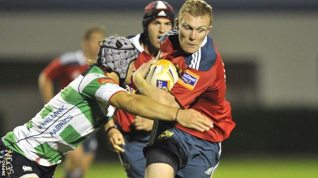 Munster wing Keith Earls is tackled in the defeat by Treviso