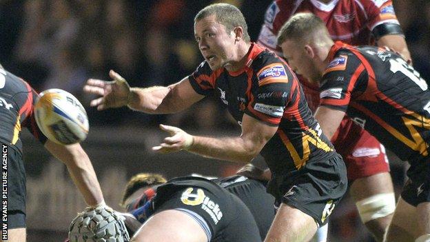 Richie Rees passes the ball from the base of a maul against Scarlets