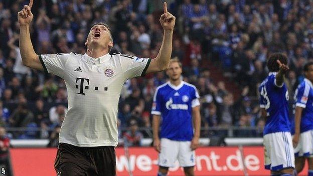 Bayern's Bastian Schweinsteiger celebrates after scoring during the German first division Bundesliga soccer match between Schalke 04 and Bayern Munich