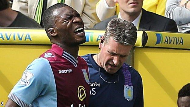 Christian Benteke limps off at Carrow Road