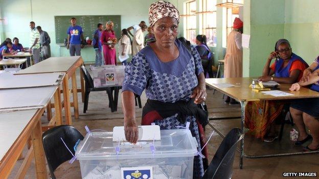 An elderly lady casts her vote at Nsongweni High School polling station in Nhlangano, Swaziland, on September 20, 2013