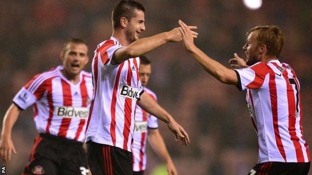 Valentin Roberge celebrates with team-mates