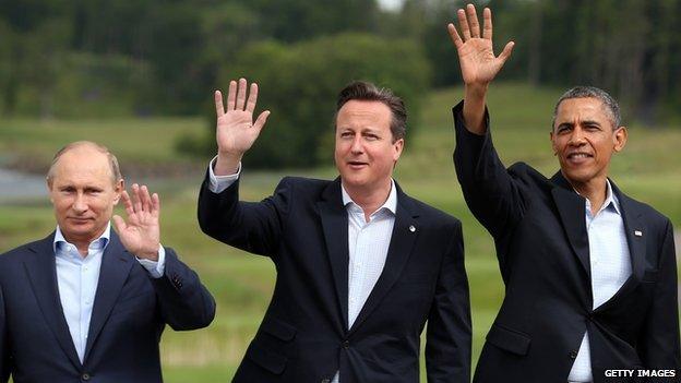 Vladimir Putin, David Cameron and Barack Obama waving