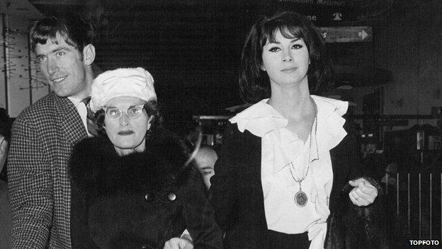 April Ashley with her mother at London Airport, 1962