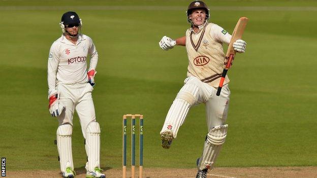 Dominic Sibley (right) celebrates reaching his hundred