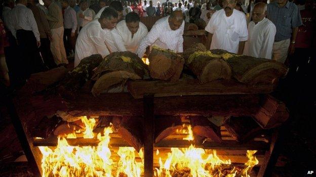 Family members light the funeral pyre of Mitul Shah, of Bidco Group of Kenya, who was shot dead in the attack on the Westgate Mall, at the Hindu Crematorium in Nairobi, Kenya 26 Thursday September 2013