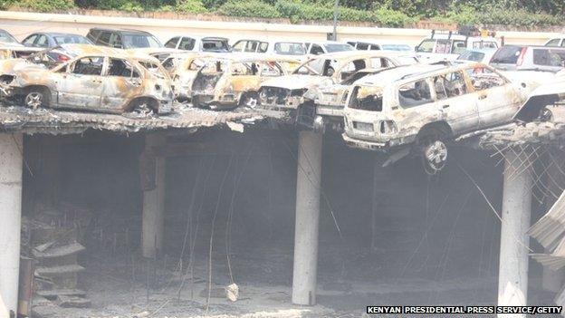 The remains of cars and other debris can be seen in a general view photographed from the rooftop, of the parking lot outside the Westgate Mall on 26 September 2013