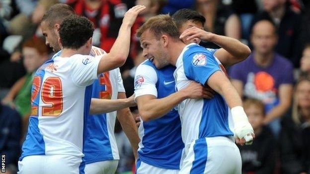 Jordan Rhodes is congratulated by his Blackburn team-mates