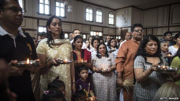 People of the Jain community hold candles during a 24 hour prayer session for the victims of the Westgate Shopping Centre attack on September 29, 2013 in Nairobi, Kenya.