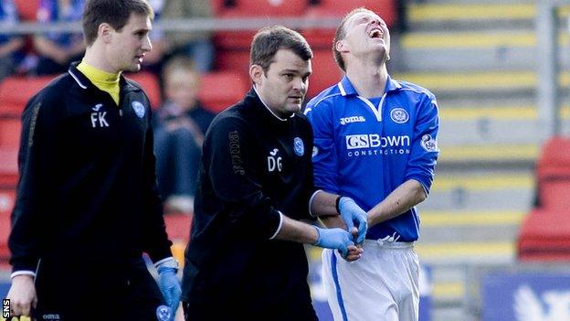 Steven Anderson is led from the field after suffering his injury