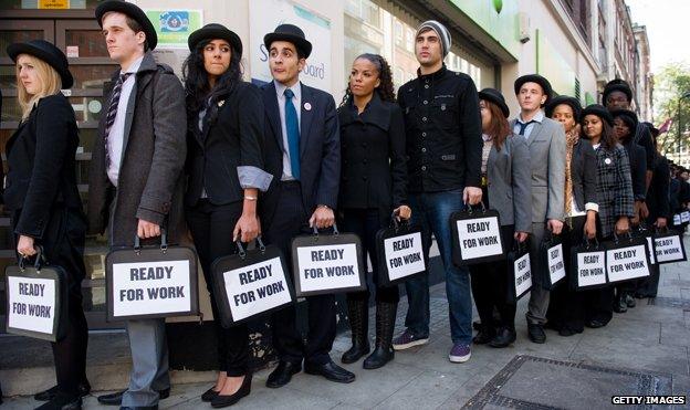 People in a queue outside a job centre highlighting youth unemployment