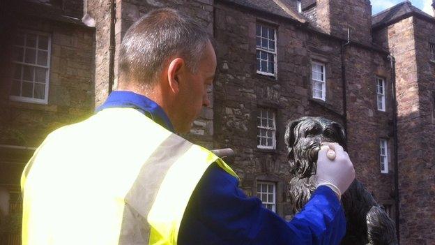 Worker with statue