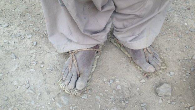 Dusty feet of a villager in remote Balochistan village