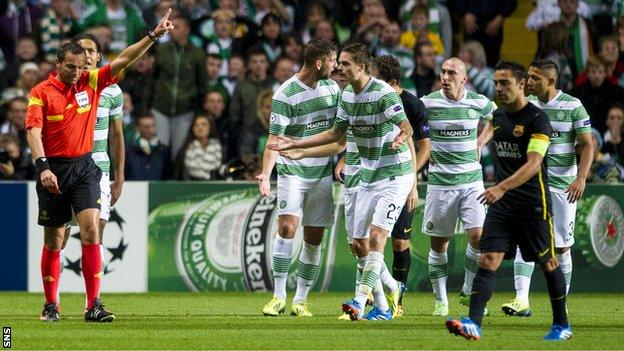 Referee Stephane Lannoy orders Celtic captain Scott Brown off against Barcelona