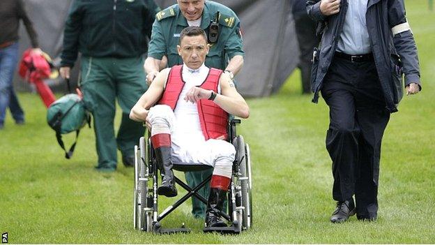 Frankie Dettori is wheeled away following his fall at Nottingham