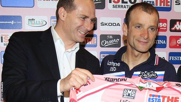 Giro d'Italia race director Michele Acquarone (left) poses with the 2011 race winner Michele Scarponi