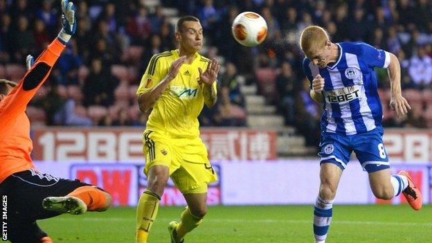 Wigan Athletic's Ben Watson (right) heads the second goal during the Uefa Europa League Group D match v Maribor