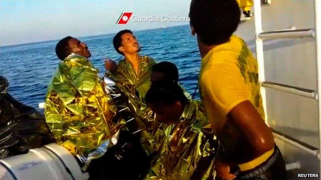 Rescued migrants in image released by Italian coastguard on 3 October 2013