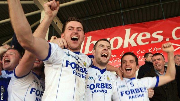 Conleith Gilligan celebrates with Ballinderry team-mates Declan Bell and Michael McIver after their 2011 Derry Final win