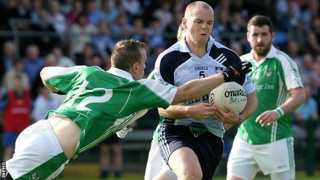 Belcoo's Declan Leonard challenges Peter Lynch in the final