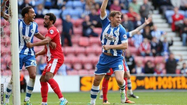 Grant Holt celebrates