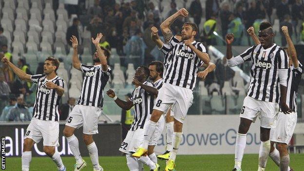 Juventus players celebrate their 3-2 win over AC Milan