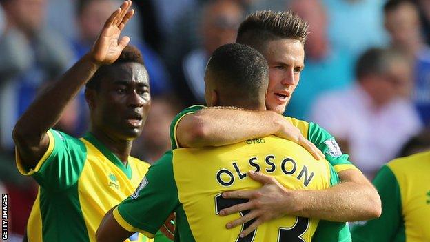 Ricky van Wolfswinkel is congratulated by team-mates for his part in the goal against Chelsea