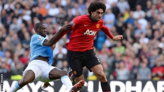 Manchester City's Yaya Toure and Manchester United's Marouane Fellaini