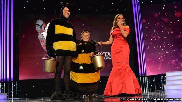 Jean Bishop and David Walliams in bee outfits, with Carol Vordeman