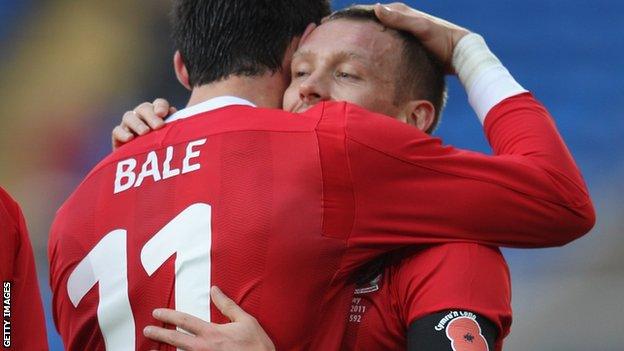 Craig Bellamy hugs Gareth Bale