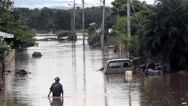 View of a flooded street in Acapulco, Guerrero state, Mexico, on September 26, 2013