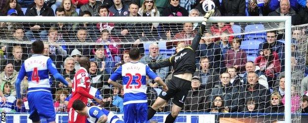 Goalkeeper Robert Green makes a save for QPR