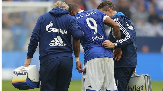 Kevin-Prince Boateng (centre) is helped off the field