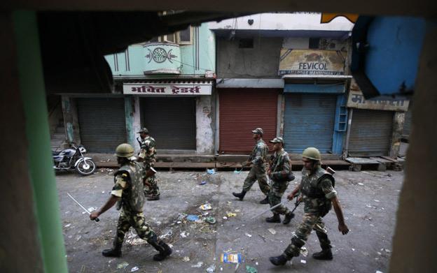 Indian army soldiers patrol curfew in Muzaffarnagar