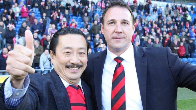 Tan Sri Vincent Tan and Malky Mackay