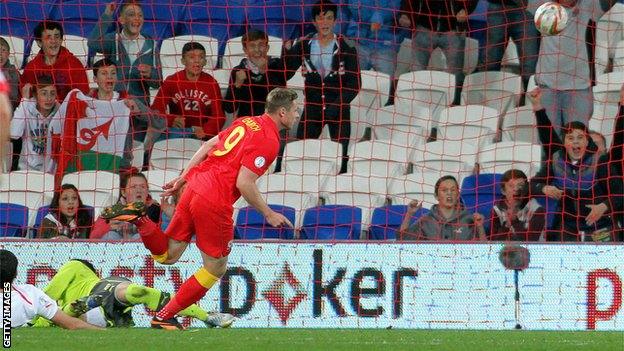 Simon Church scores the second half winner against Macedonia in Cardiff