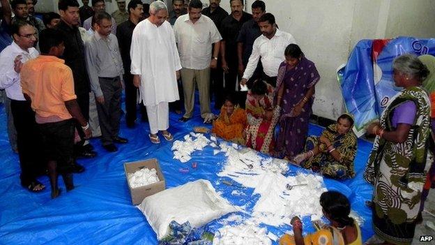 Relief items being packaged for distribution to cyclone evacuees