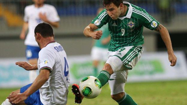 Azerbaijan's Mahir Sukurov attempts to block a Martin Paterson shot